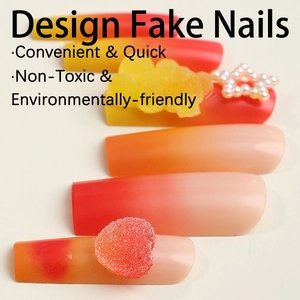 Vibrant red orange gradient press-on nails with 3D pearl stars and bear charms