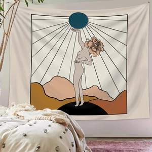Bohemian tapestry featuring minimalist line art and sun motifs over a modern bed