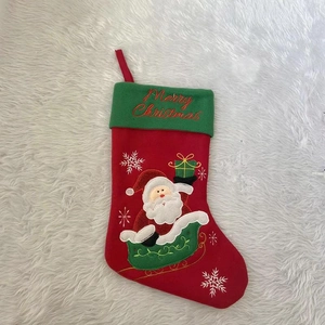 Christmas stocking with Santa Claus embroidery and Merry Christmas lettering on white fur