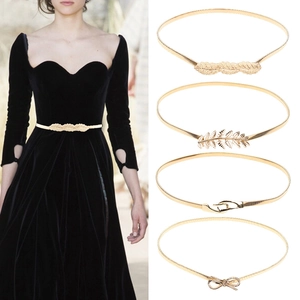 Set of four gold metal stretch belts featuring leaf, feather and bow designs for dresses