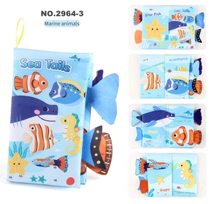 Detail of baby soft tail book showing sea creatures with textured sensory fabric tails