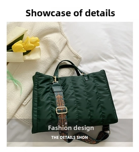 Detail of dark green quilted tote bag with bohemian floral strap and gold hardware