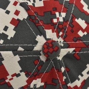 Detailed top view of digital camo baseball cap with red pixel pattern and reinforced stitching