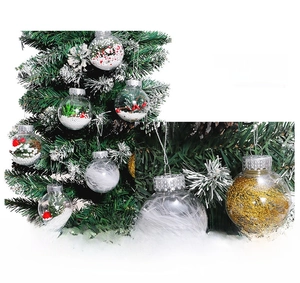Macro detail of 6cm clear Christmas ornaments with feather and berry fillings for tree decor