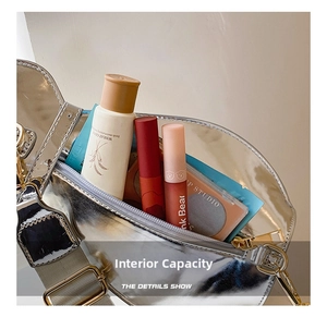 Silver metallic crossbody bag interior view showing space for lipstick and cosmetics