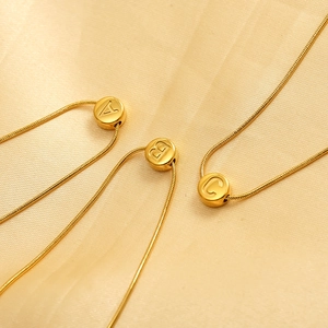 Gold stainless steel initial necklaces A B C on a luxury snake chain jewelry set