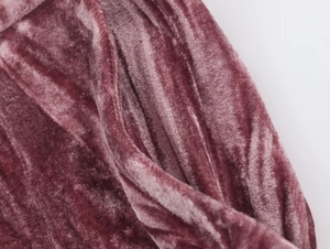 Close-up detail of luxury rose velvet fabric texture for women suits and pants