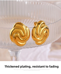 Detail of 18K gold-plated twisted square earrings with a thick electroplating finish