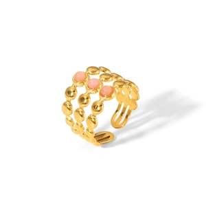 Detailed macro view of triple-layered gold open ring featuring three pink zircon gemstones