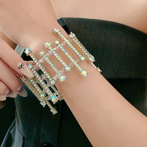Macro detail of silver layered bracelet featuring AB crystals and multi-row sparkling rhinestones