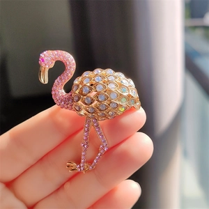 Elegant flamingo brooch with pink crystals and rhinestones in a gold alloy setting