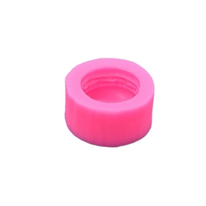 Pink silicone macaron mold for DIY candles and handmade soap making on white background