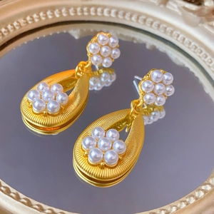 Vintage gold waterdrop earrings featuring elegant white pearl flower clusters and mirrors