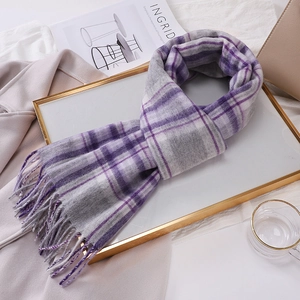 Elegant purple and grey checked wool scarf with soft tassels on a gold tray set
