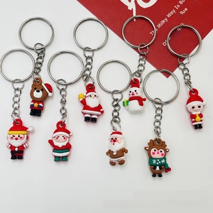 Detailed set of eight mini PVC Christmas keychains featuring Santa, snowman, and reindeer