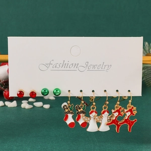 5-pair Christmas earring set with reindeer, Santa sock, and angel motifs on a white card