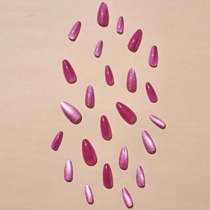 Pink cat-eye press-on nails in almond shape with shimmering galaxy light effects
