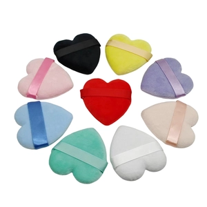 Set of nine heart-shaped flocking powder puffs in assorted colors with silk ribbons