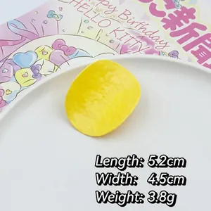 Macro detail of 5.2cm x 4.5cm realistic potato chip hair clip with wave texture