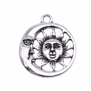 Silver zinc alloy sun and moon face pendant with hanging ring on white background