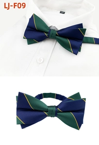 Detail of navy and green striped bowtie with diagonal yellow lines on white shirt