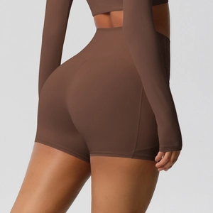 Detail view of high-waisted brown yoga shorts showing butt-lifting and slimming effect