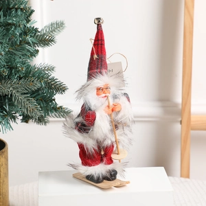Standing 18-inch Santa Claus figurine with skis and poles on a white display stand