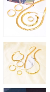 Gold-plated jewelry set with woven necklace, earrings, and ring on marble tray