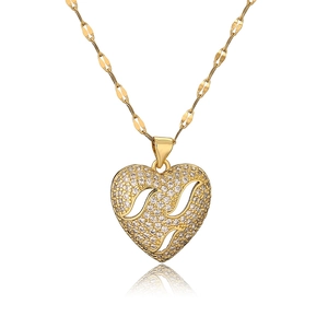Chic gold heart pendant necklace with shimmering cubic zirconia and hollowed patterns