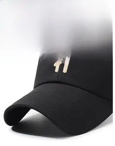 Detail of black baseball cap with breathable fabric and white H letter embroidery