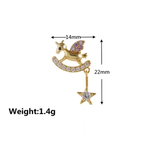 Detail view of rocking horse stud earring with gold finish and purple zircon star dangle