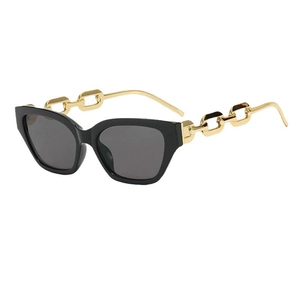 Cat eye sunglasses with black frames and gold industrial chain temples on white background