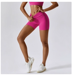 Close-up of rose pink high-waisted yoga shorts with elastic compression fabric