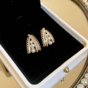 Elegant gold drop earrings with pearls and crystals in a luxury jewelry gift box