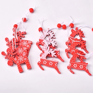 Creative red wooden Christmas reindeer ornaments with white snowflake patterns and beads