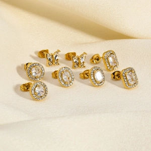 Gold titanium steel stud earrings set with round emerald and geometric zircon stones