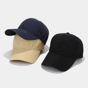 Detail of quick-dry baseball caps with laser-cut ventilation holes in various colors