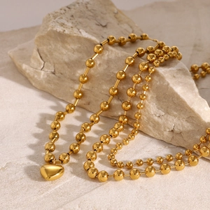 Polished 18k gold stainless steel necklace with heart pendant and beaded chain design