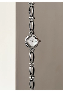 Close-up of elegant silver quartz watch with mother of pearl dial and bracelet strap