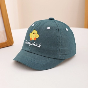 Detailed view of yellow chick embroidery and baby chick text on navy cotton baseball cap