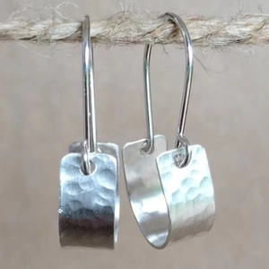 Gypsy style silver earrings with hammered texture and minimalist U-shaped geometric drops