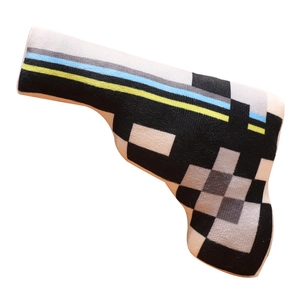 Cartoon pistol plush pillow with pixelated blue and yellow blocks on soft white fabric