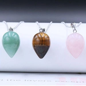 Waterdrop gemstone necklaces in green aventurine, tiger eye, and rose quartz crystals