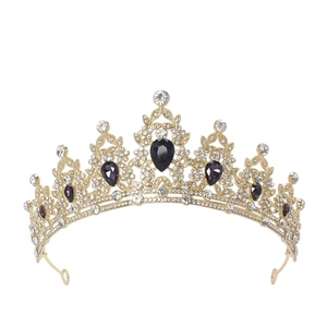 Macro detail of luxury golden crown featuring purple waterdrop gems and white crystals