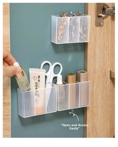 Macro view of wall-mounted translucent storage boxes inside a wooden cabinet door