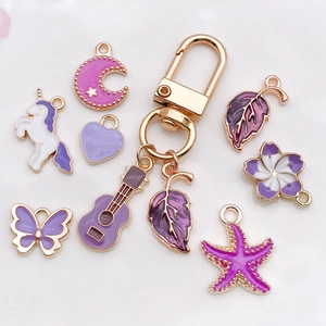 Golden keychain with purple enamel unicorn butterfly heart and guitar charms set