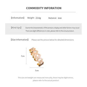 Size chart showing a 7x7cm heart pattern hollowed gold iron bangle weighing 22.6g