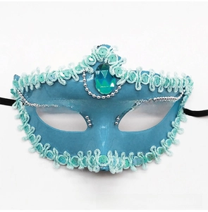 Detailed close-up of blue masquerade mask featuring sequins, lace trim and centerpiece gem