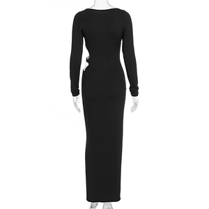 Detail of side waist cutout design on a slim fit long sleeve black maxi dress