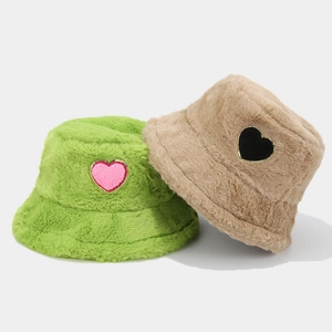 Winter plush bucket hats in green and khaki with heart patches and soft faux fur texture